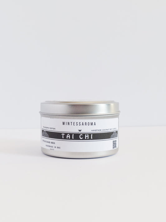 A metal candle jar with a label that reads 'Wintersaroma | Tai Chi'.