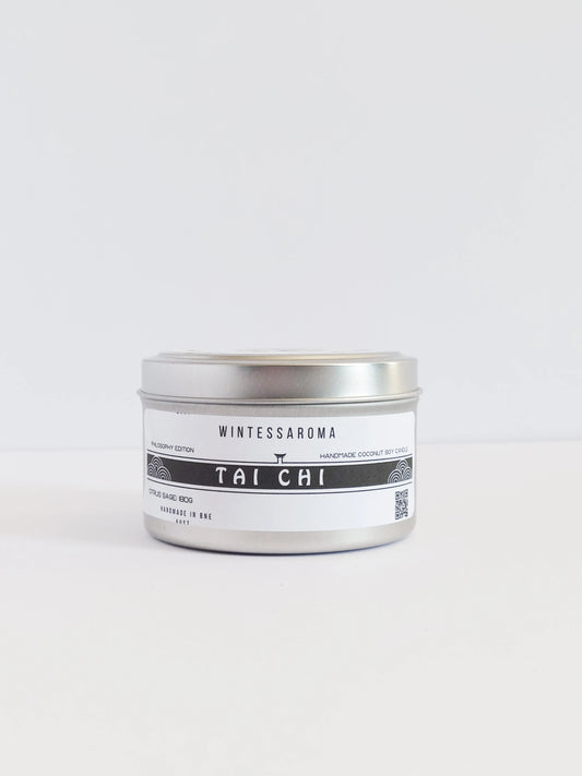 A metal candle jar with a label that reads 'Wintersaroma | Tai Chi'.